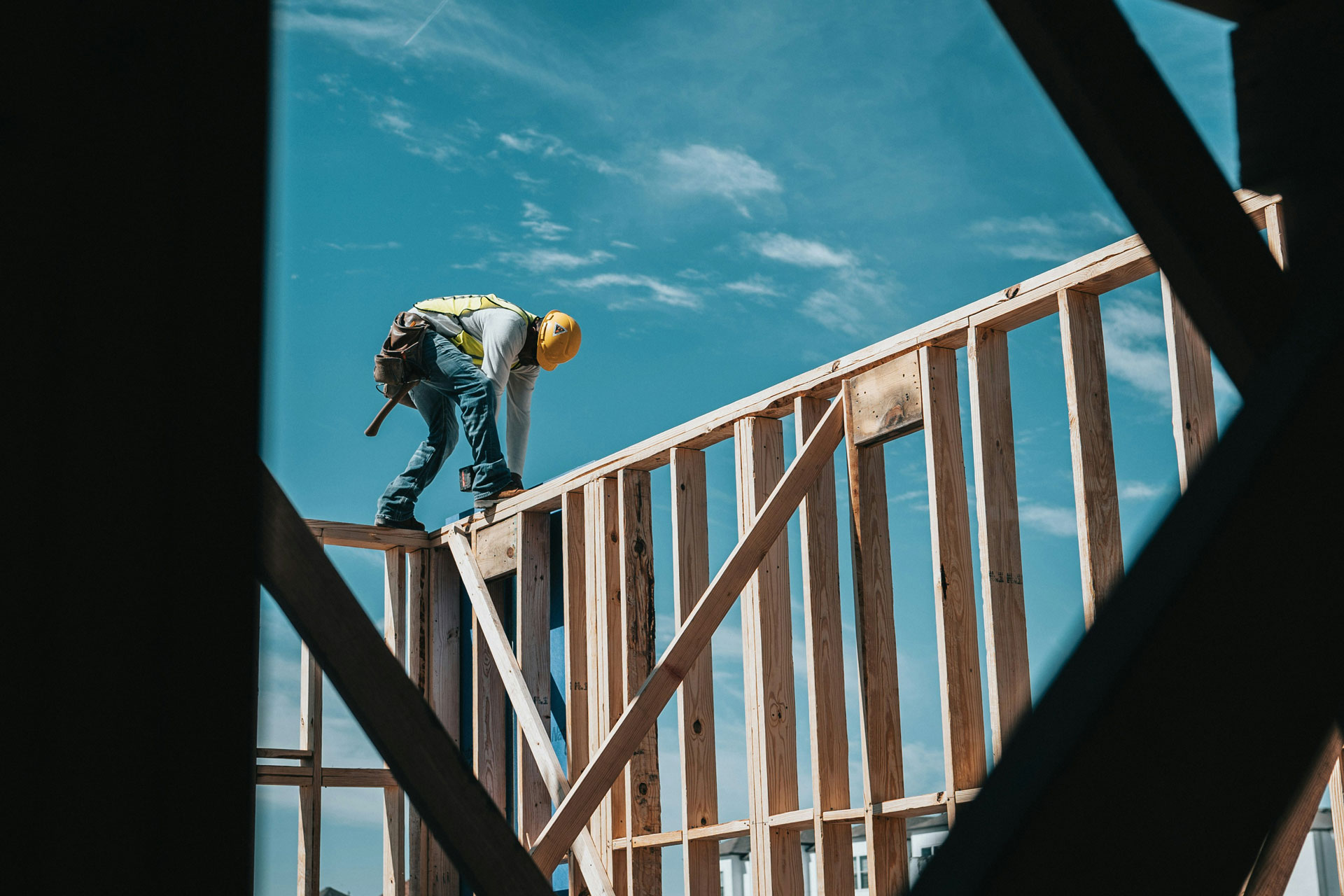 Construction worker on top of structure